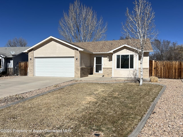 single story home with a garage, concrete driveway, brick siding, and fence