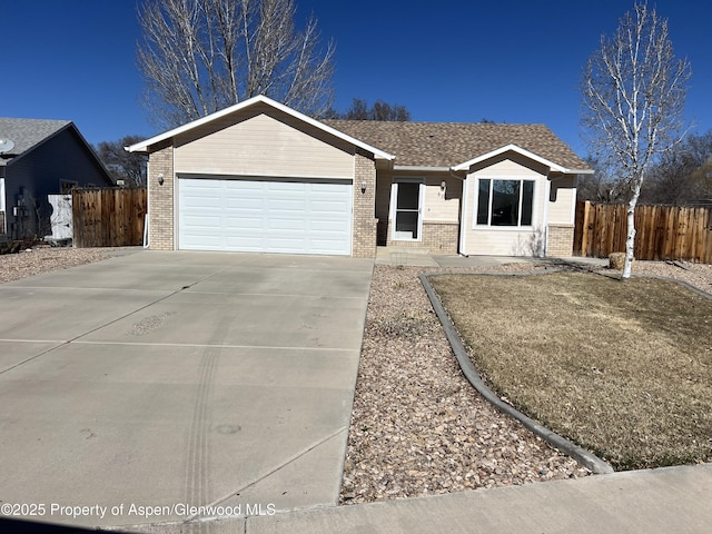 ranch-style house featuring driveway, a garage, fence, and brick siding