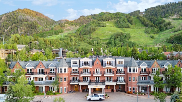 birds eye view of property with a mountain view