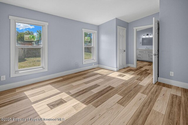 955 Sequoia Ave, Craig, CO 81625 - unfurnished bedroom with light wood-type flooring and ensuite bath