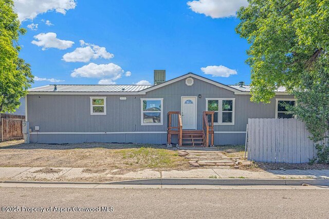 955 Sequoia Ave, Craig, CO 81625 - manufactured / mobile home featuring a chimney and a metal roof