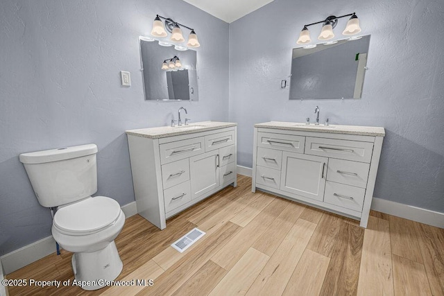 955 Sequoia Ave, Craig, CO 81625 - bathroom with vanity and wood finished floors