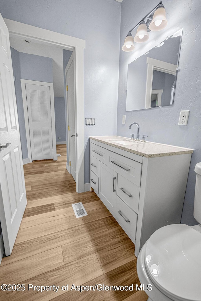 955 Sequoia Ave, Craig, CO 81625 - bathroom featuring vanity and wood finished floors
