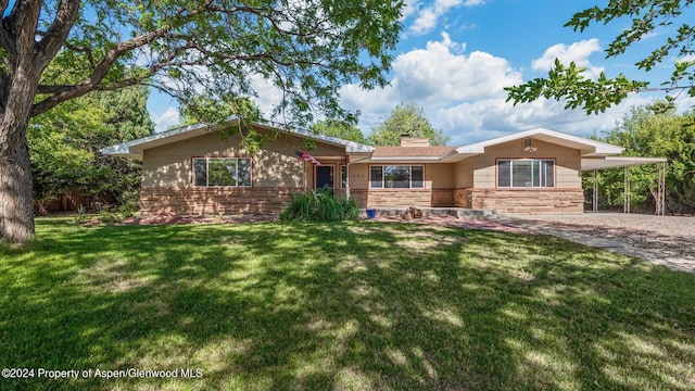 single story home with a carport and a front yard