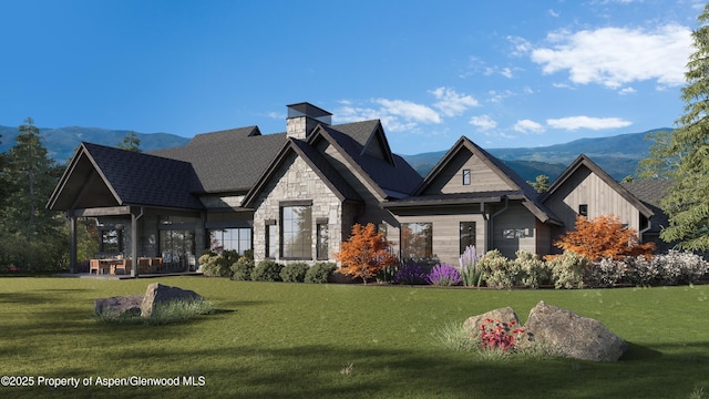 1042 Bald Eagle Way, Carbondale, CO 81623 - view of front of property featuring a front yard, stone siding, and a mountain view