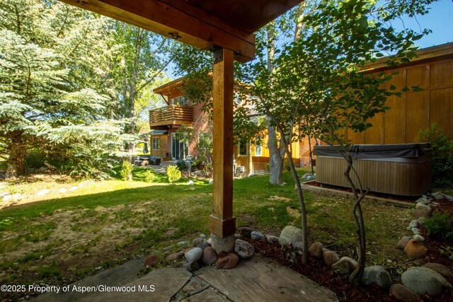 110 Easy St, Carbondale, CO 81623 - view of green lawn featuring a hot tub and a balcony