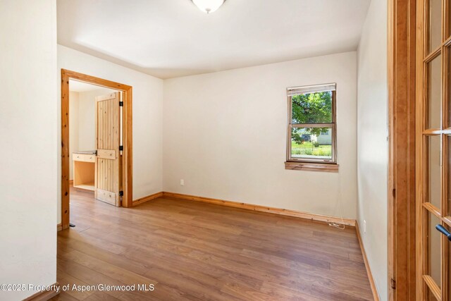 110 Easy St, Carbondale, CO 81623 - empty room with wood finished floors and baseboards