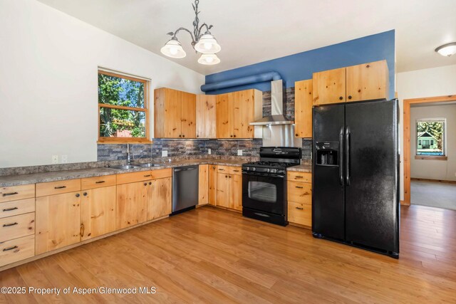 110 Easy St, Carbondale, CO 81623 - kitchen with black appliances, wall chimney exhaust hood, light brown cabinetry, decorative backsplash, and healthy amount of natural light