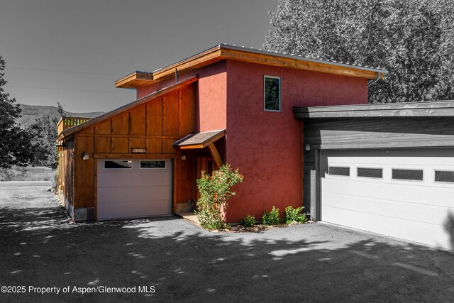 110 Easy St, Carbondale, CO 81623 - view of front of house with driveway and a garage