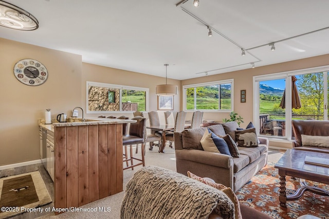 150 Snowmass Club Cir Unit 1623, Snowmass Village, CO 81615 - living area with track lighting and light colored carpet