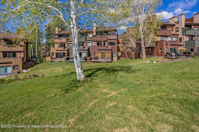 150 Snowmass Club Cir Unit 1623, Snowmass Village, CO 81615 - view of property's community with a residential view and a lawn