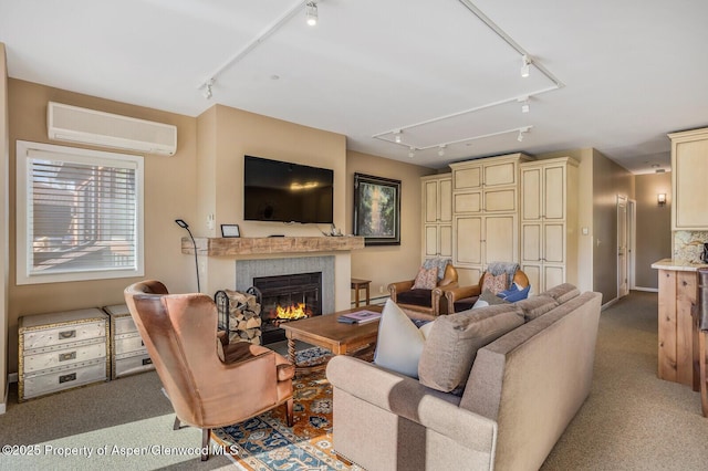 150 Snowmass Club Cir Unit 1623, Snowmass Village, CO 81615 - living area featuring rail lighting, attic access, a wall unit AC, and a tiled fireplace