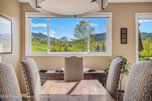 150 Snowmass Club Cir Unit 1623, Snowmass Village, CO 81615 - dining area featuring plenty of natural light and a mountain view