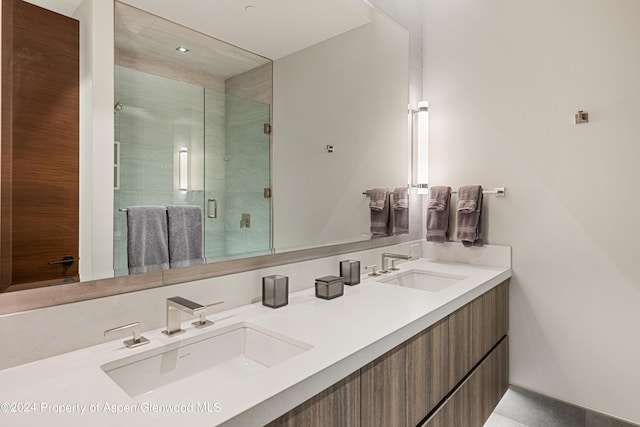 bathroom with vanity and an enclosed shower