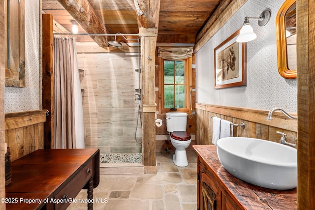 1350 Old Herron Rd, Basalt, CO 81621 - full bath featuring wood ceiling, a shower stall, vanity, wallpapered walls, and stone finish floors