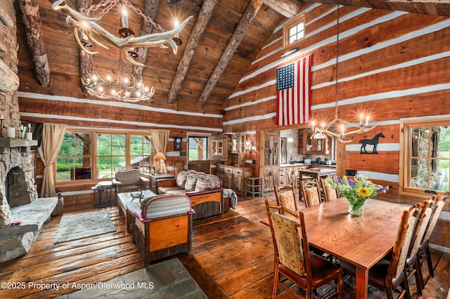 1350 Old Herron Rd, Basalt, CO 81621 - dining room with a chandelier, wood-type flooring, a wooden ceiling with exposed beams, plenty of natural light, and high vaulted ceiling