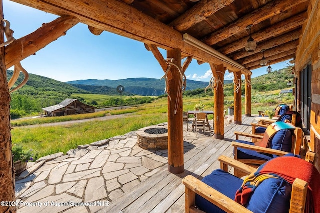 1350 Old Herron Rd, Basalt, CO 81621 - wooden terrace featuring an outdoor fire pit and a mountain view