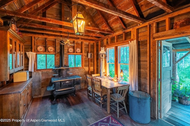 1350 Old Herron Rd, Basalt, CO 81621 - dining room with a wood stove, wood walls, wood-type flooring, and wood ceiling
