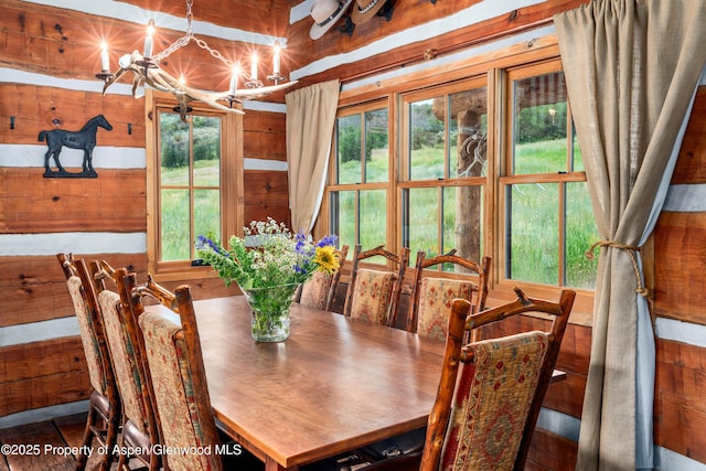 1350 Old Herron Rd, Basalt, CO 81621 - dining space featuring wooden walls, plenty of natural light, and a chandelier