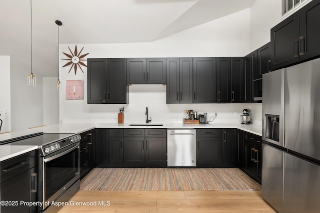 1625 Cooper Ave, Glenwood Springs, CO 81601 - kitchen featuring a sink, light countertops, appliances with stainless steel finishes, and light wood finished floors