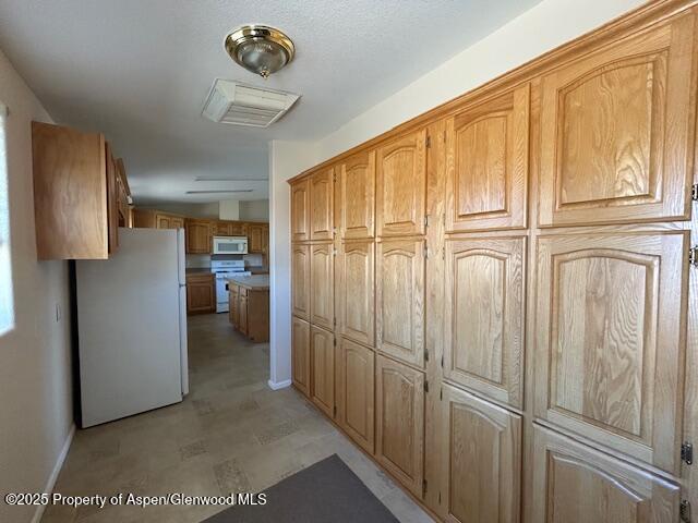 corridor featuring baseboards