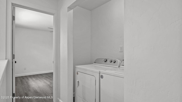 2430 W Ave, Rifle, CO 81650 - washroom featuring washer and dryer and wood finished floors