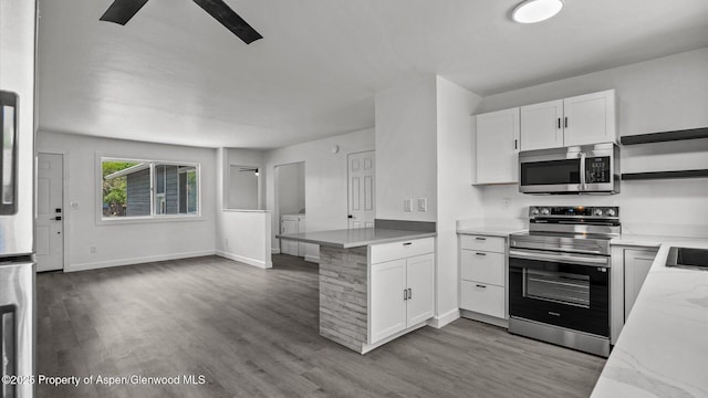 2430 W Ave, Rifle, CO 81650 - kitchen featuring appliances with stainless steel finishes, open shelves, white cabinets, and wood finished floors