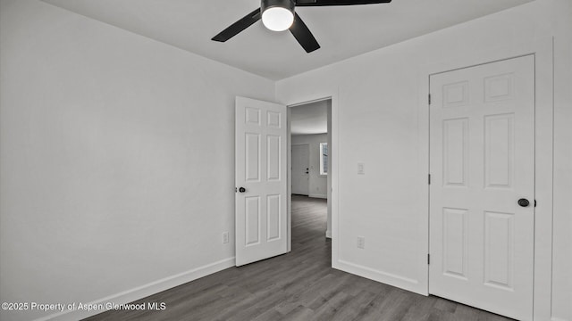 2430 W Ave, Rifle, CO 81650 - unfurnished bedroom with wood finished floors and ceiling fan