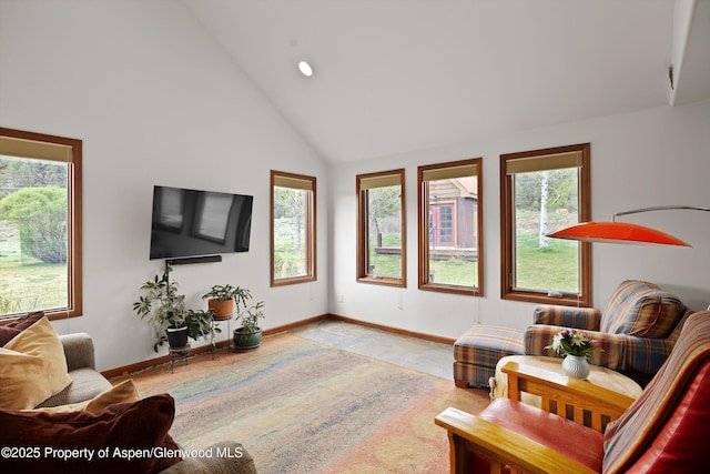 living room with high vaulted ceiling, baseboards, and recessed lighting