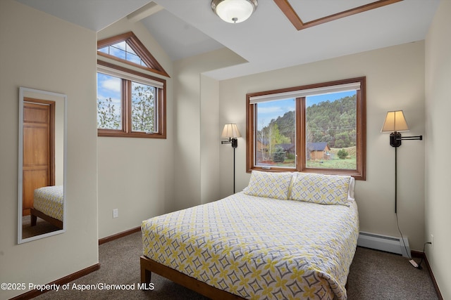 bedroom featuring carpet floors, baseboards, a baseboard heating unit, and vaulted ceiling