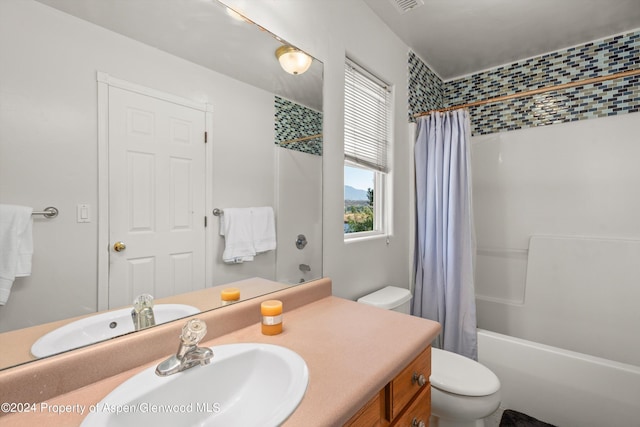 full bathroom with vanity, toilet, and shower / bathtub combination with curtain