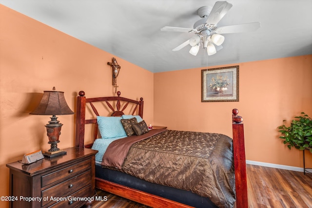 bedroom featuring hardwood / wood-style flooring and ceiling fan