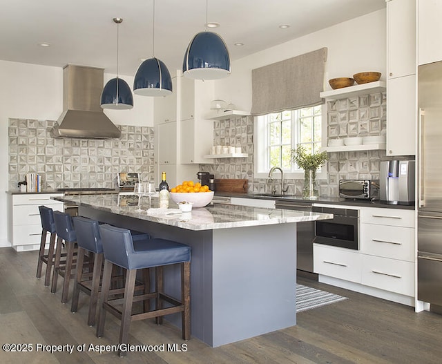 87 Thunderbowl Ln, Aspen, CO 81611 - kitchen with island exhaust hood, open shelves, modern cabinets, backsplash, and recessed lighting