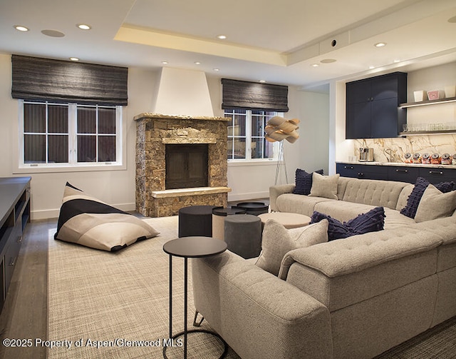 87 Thunderbowl Ln, Aspen, CO 81611 - living room with recessed lighting, wood finished floors, a fireplace, and a raised ceiling