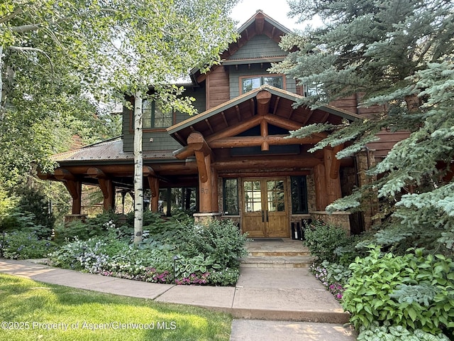 87 Thunderbowl Ln, Aspen, CO 81611 - view of front of house with french doors and covered porch