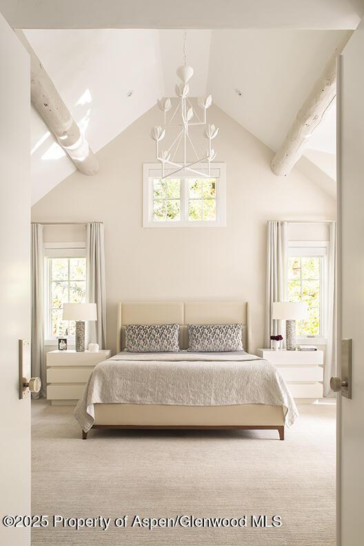 87 Thunderbowl Ln, Aspen, CO 81611 - carpeted bedroom featuring a chandelier and multiple windows