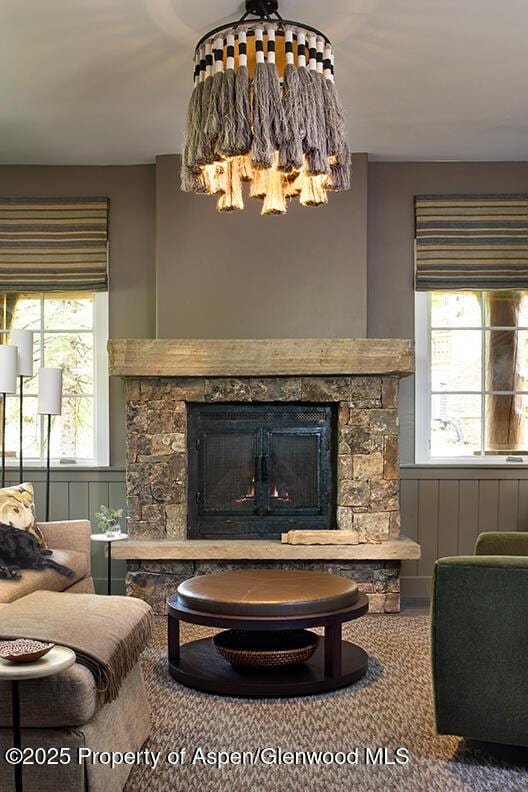 87 Thunderbowl Ln, Aspen, CO 81611 - living area featuring a fireplace and plenty of natural light