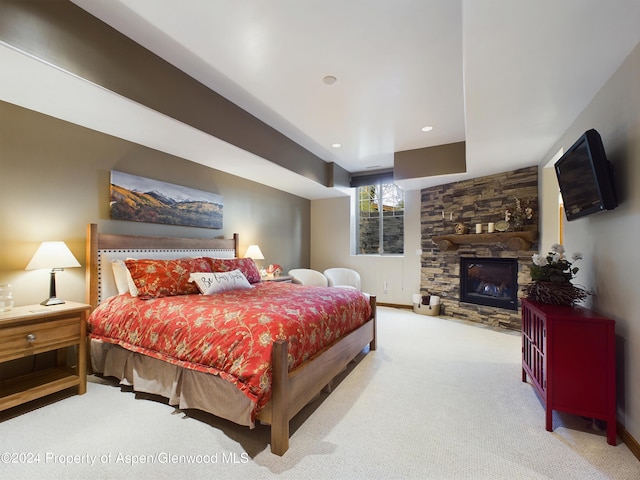 bedroom with recessed lighting, a fireplace, baseboards, and carpet floors