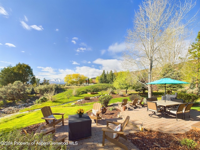 view of patio with an outdoor fire pit