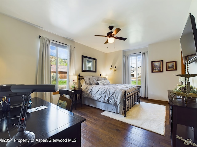 bedroom featuring a ceiling fan and hardwood / wood-style floors