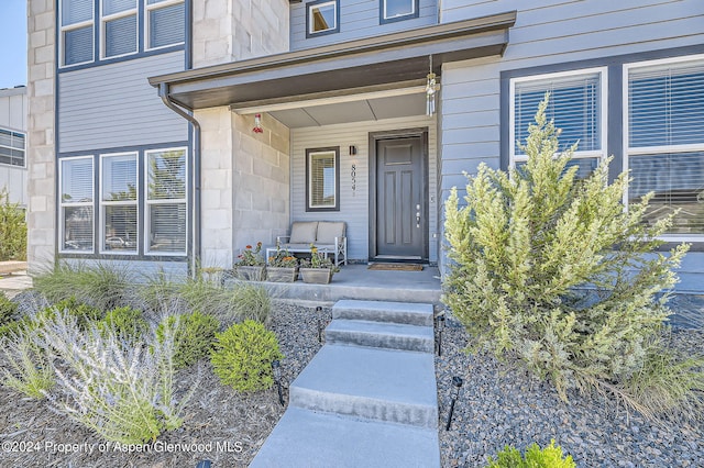 property entrance featuring covered porch