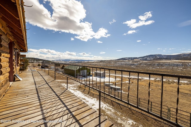 balcony with a mountain view and an exterior structure