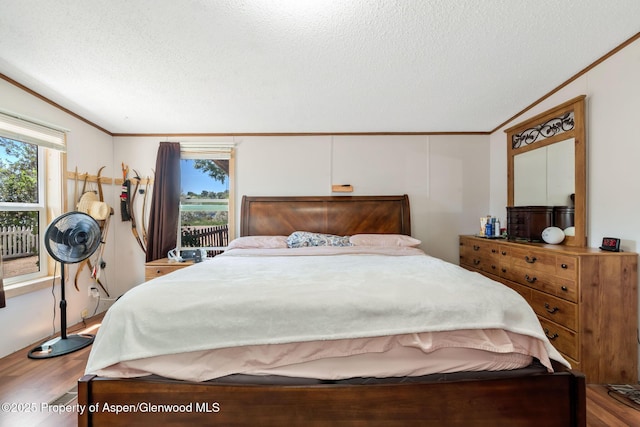 1137 Rose St, Craig, CO 81625 - bedroom featuring wood finished floors, ornamental molding, and a textured ceiling