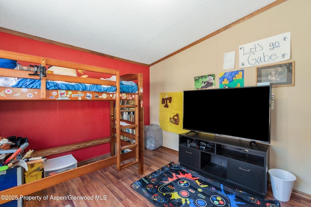 1137 Rose St, Craig, CO 81625 - bedroom with a textured ceiling, crown molding, lofted ceiling, and wood finished floors