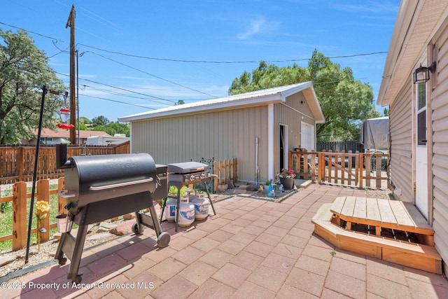 1137 Rose St, Craig, CO 81625 - fenced backyard with area for grilling, a patio, and an outbuilding