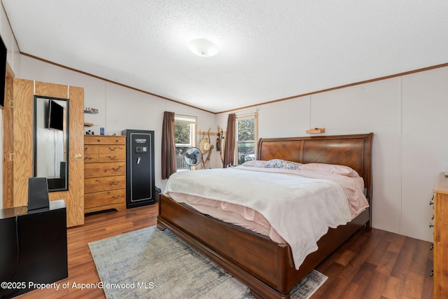 1137 Rose St, Craig, CO 81625 - bedroom featuring lofted ceiling, wood finished floors, a textured ceiling, and ornamental molding