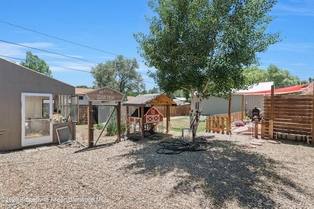 1137 Rose St, Craig, CO 81625 - fenced backyard with exterior structure and an outbuilding