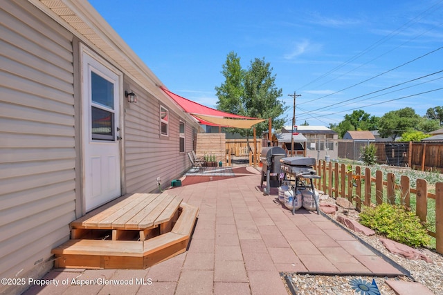 1137 Rose St, Craig, CO 81625 - fenced backyard with a patio area and area for grilling