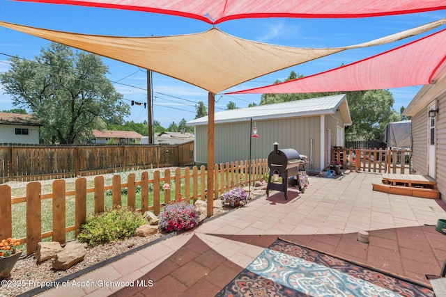 1137 Rose St, Craig, CO 81625 - fenced backyard featuring a grill and a patio