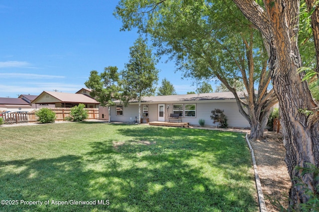 1137 Rose St, Craig, CO 81625 - view of front of home with a fenced backyard and a wooden deck